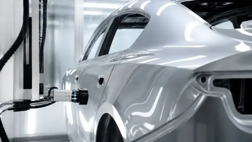Premium Electric Vehicle Inspection at Factory Dusk