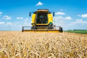combine-harvester-working-field-1